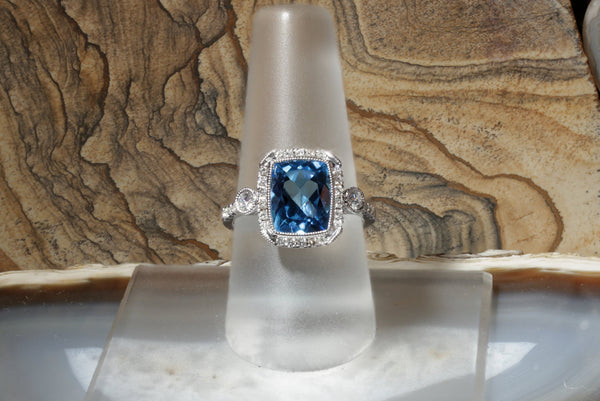 Blue Topaz and Diamond Halo Ring