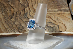 Blue Topaz and Diamond Halo Ring